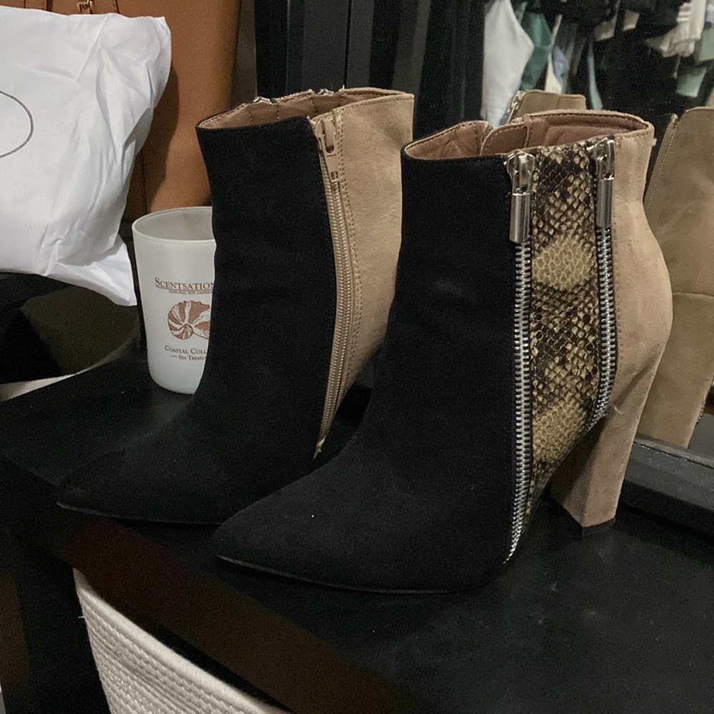 Black and snakeskin pointed toe zipper booties